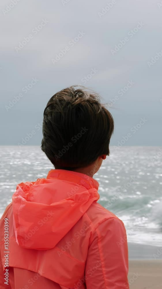 Portrait of happy and confident woman standing on edge of sea. Vertical video Portrait of happy and confident woman standing on edge of sea. Vertical video