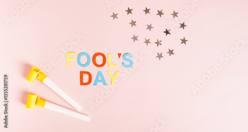 Obraz na płótnie Happy April Fools' Day with colored letters, whistles and stars on pink web banner w salonie