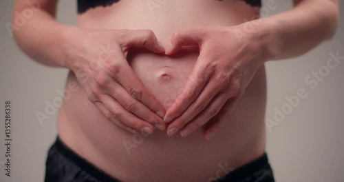 Wallpaper Mural Woman Places Hands In Heart Shape On Pregnant Belly Torontodigital.ca