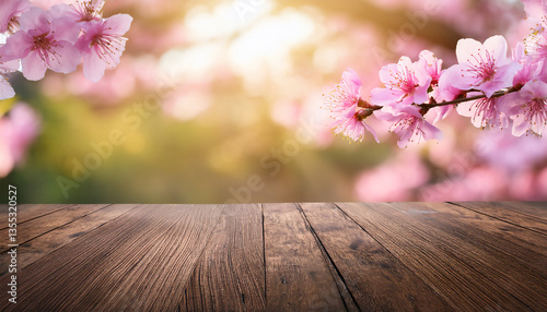 Rustic Brown Wooden Plank with Softly Blurred Pink Flower Background: Perfect for Showcasing Your Fresh Product photo
