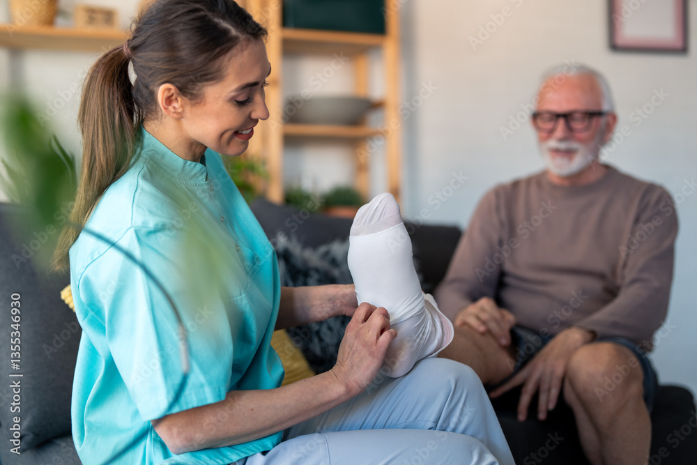 Obraz premium Compassionate Female Nurse Assists Elderly Male Patient in Wearing Anti-Thrombosis Stockings at Home