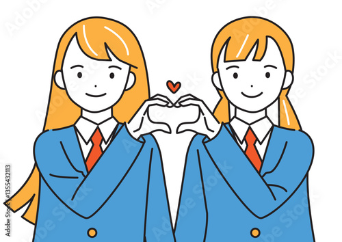 指でハートマークを作るポーズの女子学生