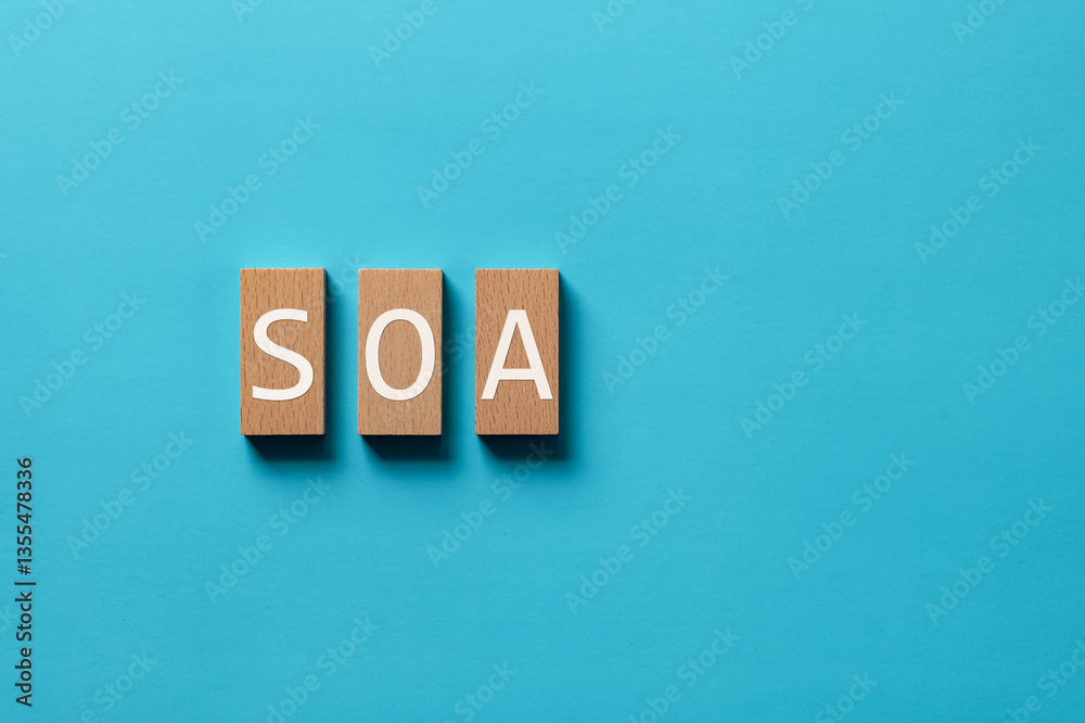 Obraz premium There is wood block with the word SOA. It is an abbreviation for Service Oriented Architecture as eye-catching image.