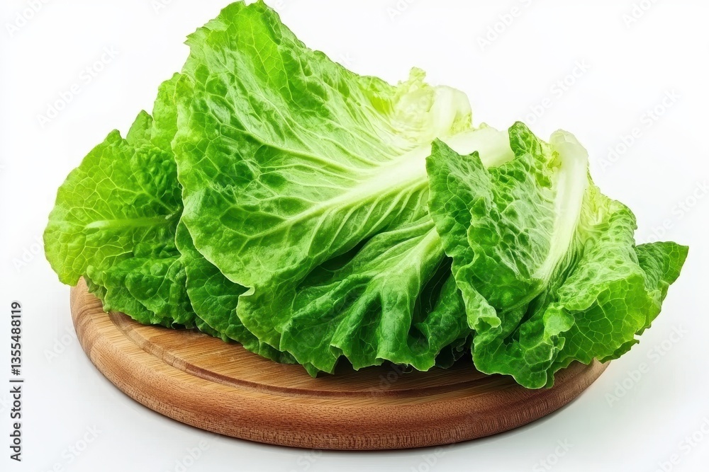 A woman chopping lettuce on a wooden kitchen counter preparing healthy meals at home A woman chopping lettuce on a wooden kitchen counter preparing healthy meals at home