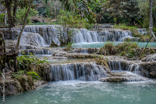 Terraced Waterfalls and Turquoise Pools at Kuang Si Falls with Lush Jungle Surroundings near Luang Prabang, Laos