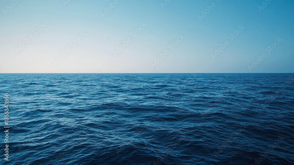 Fototapeta premium A serene ocean view with deep blue water and gradient effect from dark to light, evoking sense of calm and tranquility