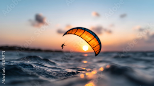 Silhouette of Kitesurfer at Sunset Over Ocean Waves
