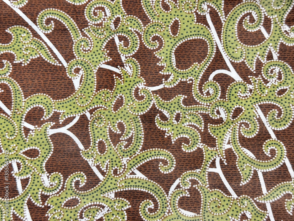 Close up of brown fabric with classic ornamental green pattern. European classic green and brown engraving swirls random shapes. Seamless background texture. Close up of brown fabric with classic ornamental green pattern. European classic green and brown engraving swirls random shapes. Seamless background texture.