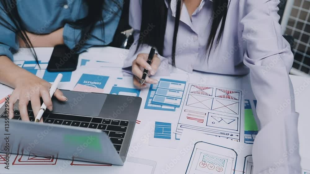 Website designer, Creative planning phone app development template layout framework wireframe design, User experience concept, Young asian woman UX designer working on smartphone application at office