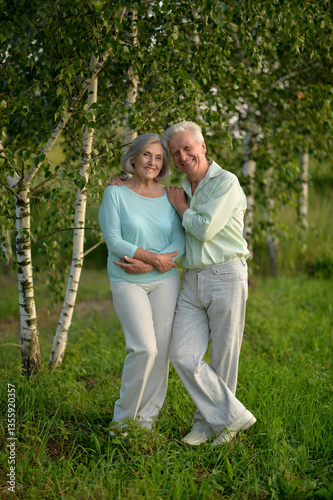Obraz na płótnie Romantic elderly senior couple embracing in nature w salonie