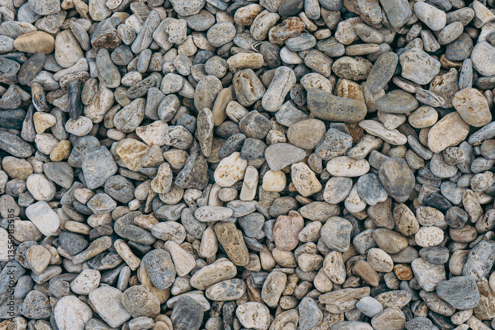 Small stones background, stone seashore texture Small stones background, stone seashore texture