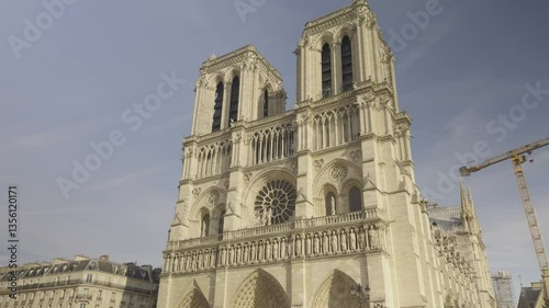 Facade of Notre-Dame de Paris after reconstruction, crane in background, Paris, France