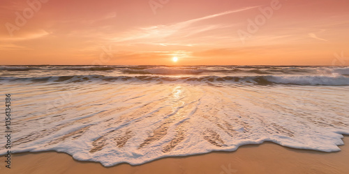 Golden hour beach sunset soft waves on sandy shore