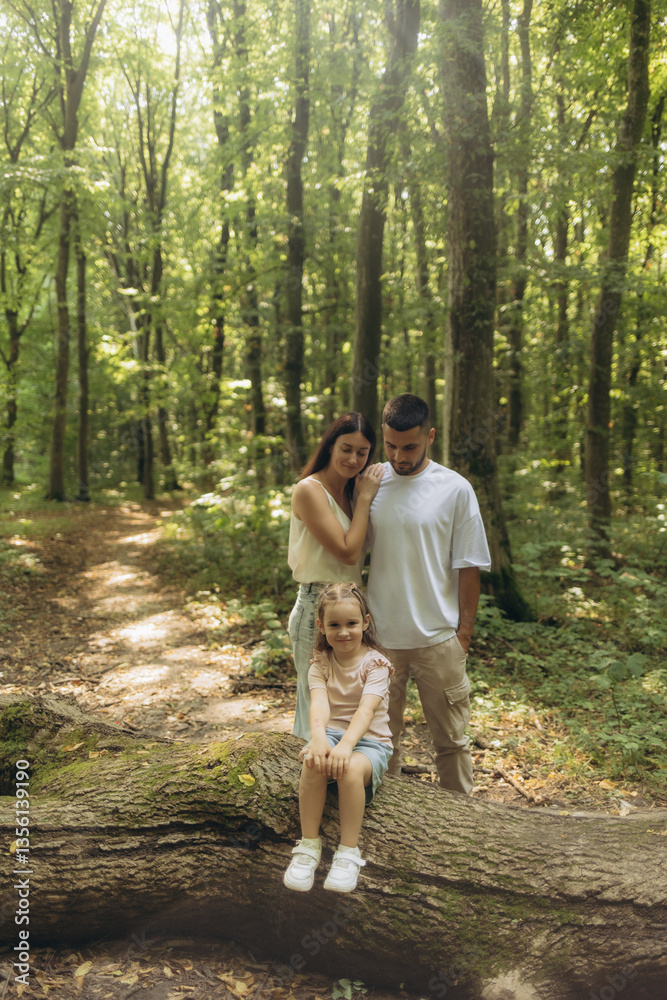 Fototapeta premium Family Enjoying Together in a Scenic Forest Setting During Daytime
