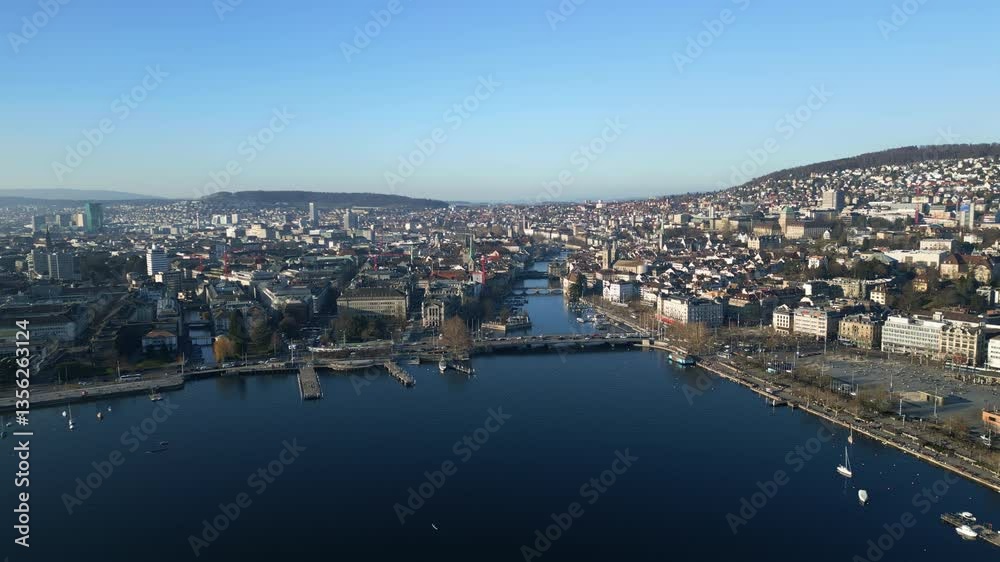 Aerial: Quay Bridge with Lake Zurich, cityscape and blue sky during the day in Zurich, canton of Zurich, Switzerland, establishing drone shot Aerial: Quay Bridge with Lake Zurich, cityscape and blue sky during the day in Zurich, canton of Zurich, Switzerland, establishing drone shot