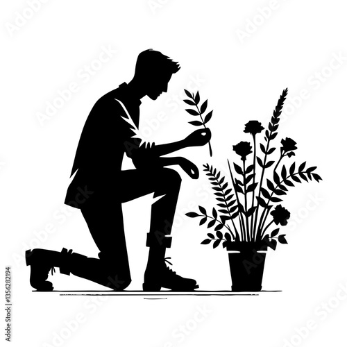 Man kneeling and tending to arrange flowers in silhouette  