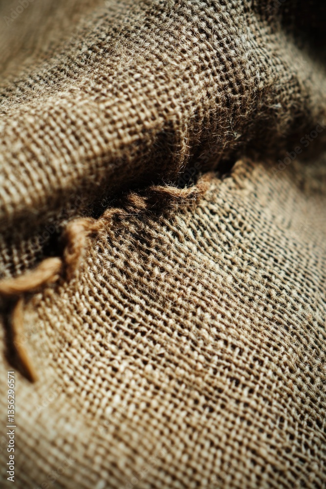 A detailed view of the texture and pattern on a piece of burlock fabric A detailed view of the texture and pattern on a piece of burlock fabric