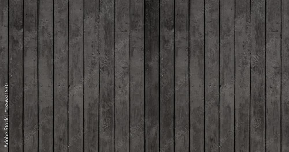 Weathered Black Wooden Fance Loop. Old Rough Wooden Wall Painted Black With Visible Wood Structure And Rings. Black Wooden Boards Arranged Vertically. Close up. 