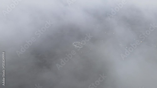 Aerial View of Foggy Desert Gathering – Vehicles in Circular Formation