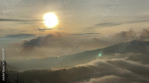 Golden Sunrise Over Misty Mountain Ridges