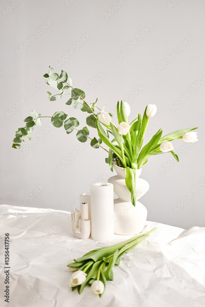 custom made wallpaper toronto digitalComposition of white tulips, eucalyptus and candles in a decorative vase. Light interior minimalism with spring mood, blurred foreground. Copy space. Still life