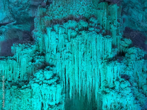 blue lit salt crystal stalactites
