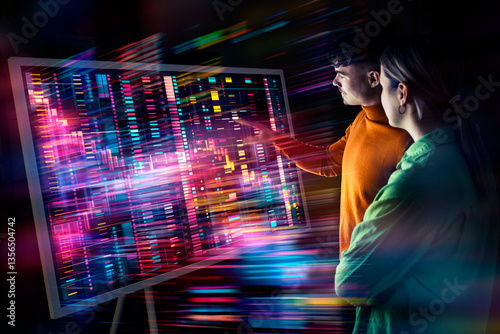 Two people collaborating on a digital screen with augmented reality and data visualization