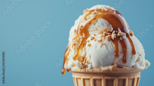 A scoop of vanilla ice cream with caramel in a waffle cone on the blue background. Summer and sweet menu concept. Cooling summer dessert. AI generation