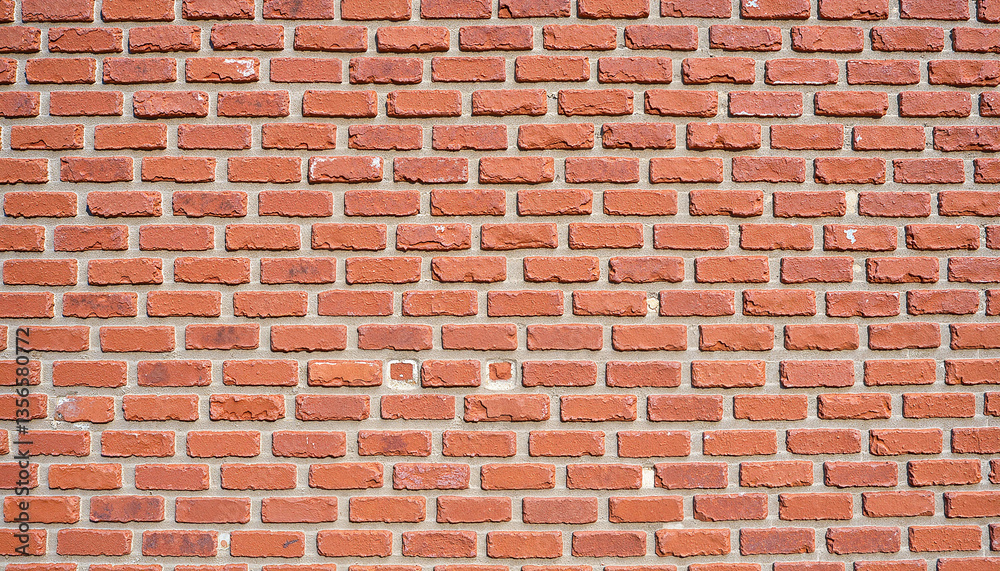 Textured red brick wall with natural colors, architectural detail Textured red brick wall with natural colors, architectural detail