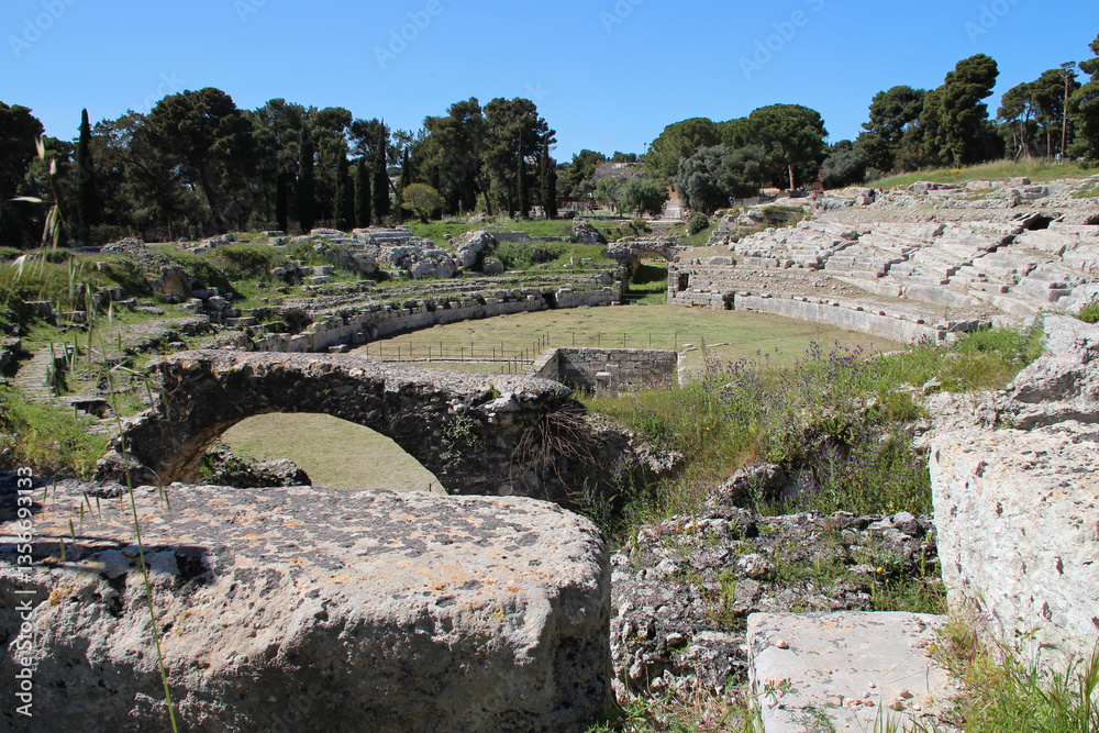 ruined ancient amphitheatre in syracuse in sicily in italy