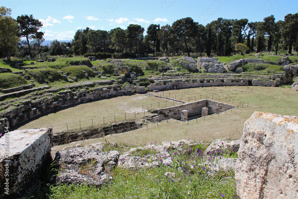 ruined ancient amphitheatre in syracuse in sicily in italy