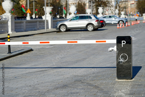 Obraz na płótnie Modern parking barrier with visible impact damage and shattered glass, restricted vehicle entry point, vandalism. Damaged security barrier at lot entrance, accident impact or deliberate destruction w salonie