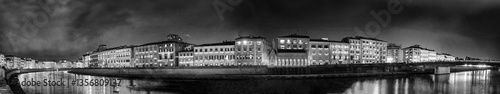 Obraz na płótnie Panoramic view of Pisa buildings along Arno river at night during Luminara - Italy w salonie