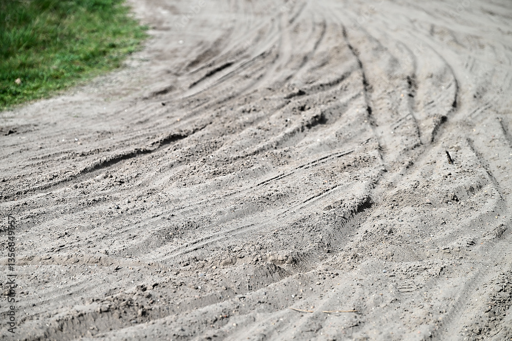Multiple Bicycle tire tracks in a sandy road
