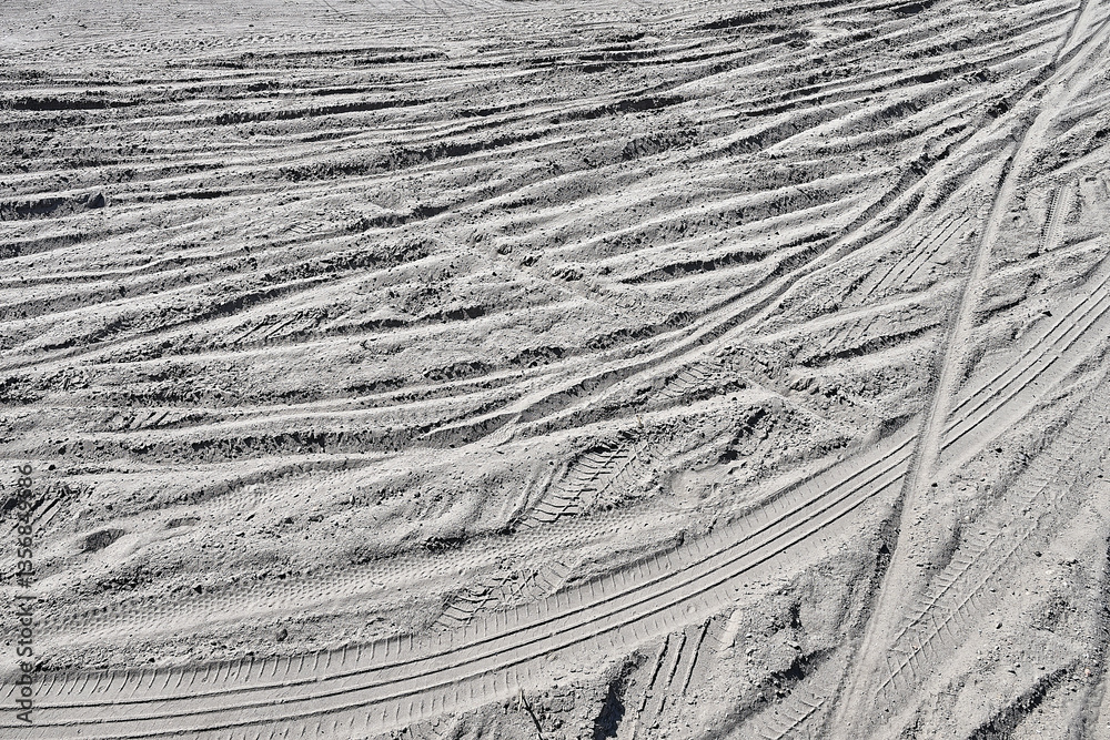 Multiple Bicycle tire tracks in a sandy road
