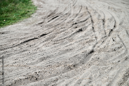 Multiple Bicycle tire tracks  in a sandy road
