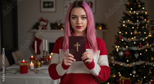 Girl with pink hair holding bible against background of room with christmas decoration. Christian christmas background. Modern christianity