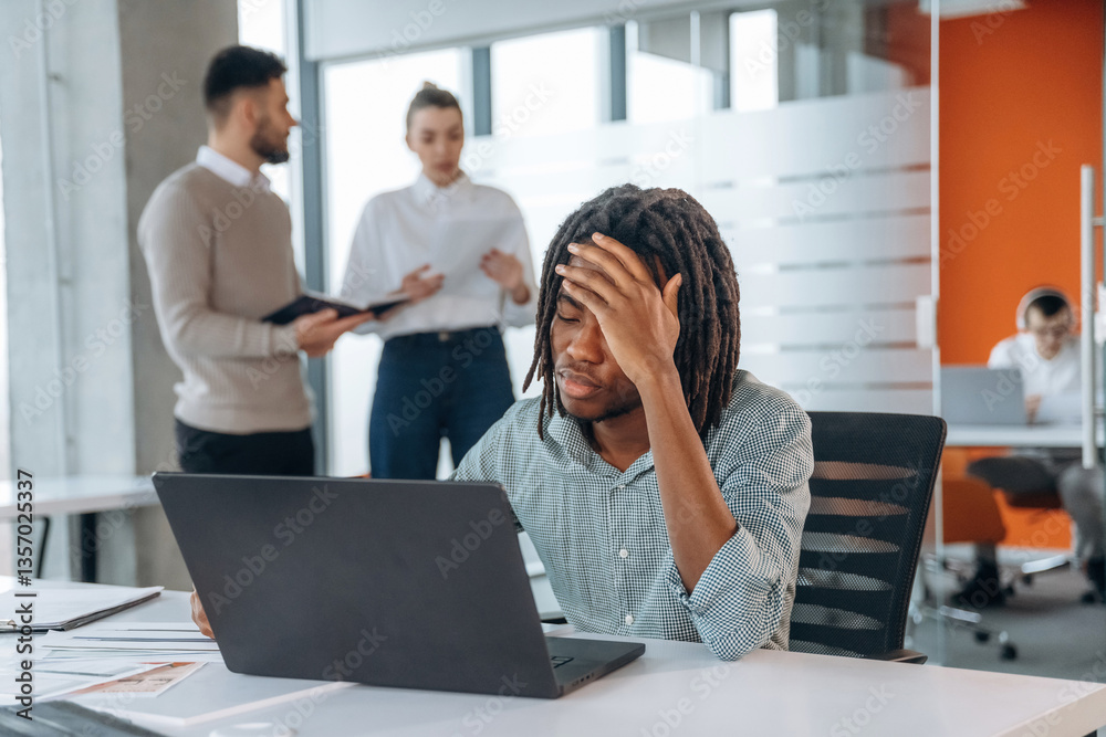 Exhausted, feeling tired, headache. People are working in the office together Exhausted, feeling tired, headache. People are working in the office together