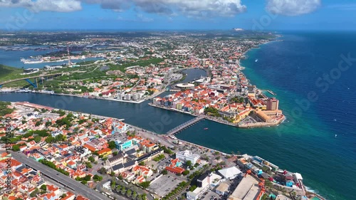 Willemstad historic city center aerial view including Otrobanda on the left and Punda on the right in city of Willemstad, Curacao. Historic Willemstad is a UNESCO World Heritage Site. 