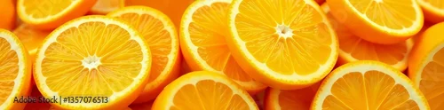 Obraz Close-up of a heap of freshly sliced ripe oranges, creating a refreshing citrus backdrop, tropical, natural