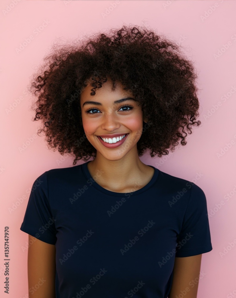 Smiling Woman with Afro Hairstyle Posing Against Pink Wall for Portrait Photography Session Smiling Woman with Afro Hairstyle Posing Against Pink Wall for Portrait Photography Session