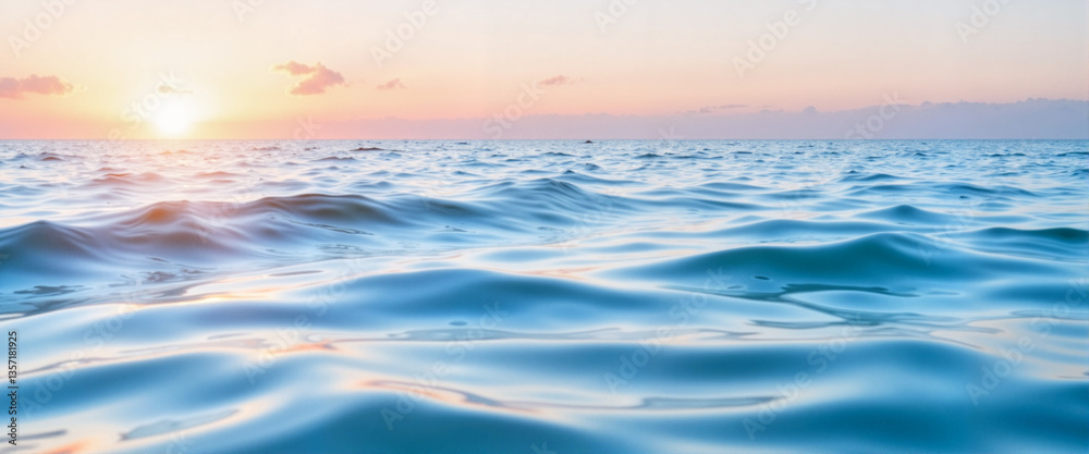 Fototapeta premium Calm ocean waves at sunrise reflecting soft pastel colors, tranquility