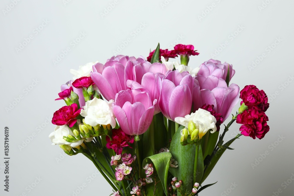 Beautiful bouquet of fresh flowers on a gray background Beautiful bouquet of fresh flowers on a gray background
