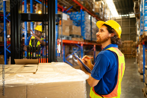 A warehouse worker inspects inventory with a clipboard, ensuring efficient operations and safety in a busy environment.