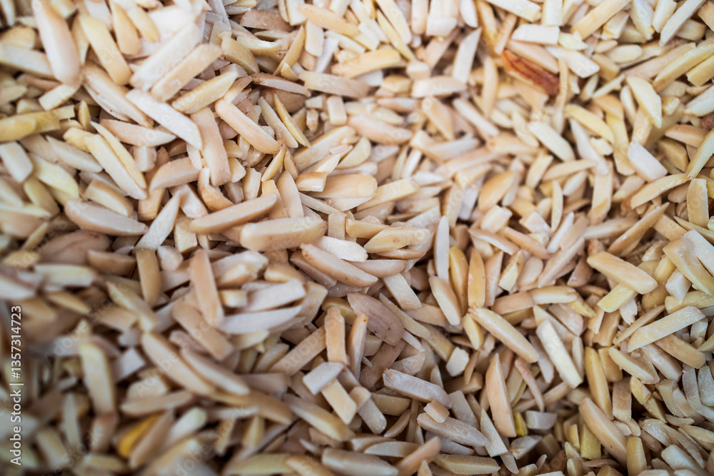 Sliced almond pieces in the spice section. Sliced almond pieces in the spice section.