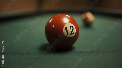Close-up of billiard ball twelve on a green felt table. photo