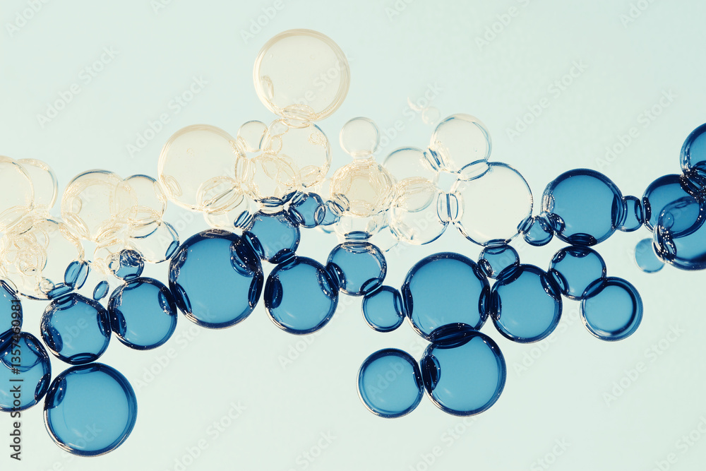 Fototapeta premium Abstract Molecular Bubbles: Capturing the essence of scientific exploration, this image features a captivating arrangement of blue and clear bubbles.