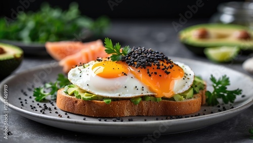 Two pieces of whole grain toast topped with slices of avocado