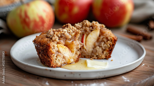 Apple cinnamon crumble muffin halved on plate, soft interior with streusel topping, cozy baked good for breakfast and snack marketing