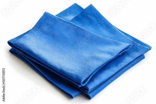 Folded blue napkins stacked on a white background view